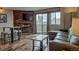Inviting living room boasts a fireplace, tv, leather couch and a sliding door to the balcony at 611 Village Rd # 620, Breckenridge, CO 80424