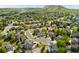 A lovely aerial view showcasing this home's neighborhood location near open space and a hill at 1825 Cooper Ct, Castle Rock, CO 80109