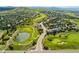 Scenic aerial view of the golf course community with lush green landscaping and mountain backdrop at 1825 Cooper Ct, Castle Rock, CO 80109