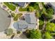 Aerial view of a home with a well maintained roof, landscaping, and a spacious driveway at 1825 Cooper Ct, Castle Rock, CO 80109