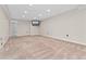 Finished basement featuring neutral carpet, recessed lights, and access to another room at 1825 Cooper Ct, Castle Rock, CO 80109