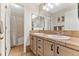 Bathroom featuring a double vanity with tile countertop, cabinets and a shower tub combination at 1825 Cooper Ct, Castle Rock, CO 80109