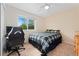 Comfortable bedroom featuring a window, ceiling fan and gaming setup perfect for relaxing at 1825 Cooper Ct, Castle Rock, CO 80109