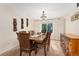 Elegant dining room featuring a large wooden table with seating for eight and modern light fixture at 1825 Cooper Ct, Castle Rock, CO 80109