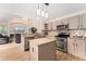 Charming kitchen features an island, granite countertops, stainless steel appliances, and hardwood flooring at 1825 Cooper Ct, Castle Rock, CO 80109