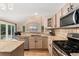 Spacious kitchen with island, stainless appliances, and open layout to Gathering room for easy entertaining at 1825 Cooper Ct, Castle Rock, CO 80109