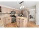 Well-equipped kitchen featuring stainless steel appliances, granite countertops, and an island for food preparation at 1825 Cooper Ct, Castle Rock, CO 80109