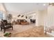 A welcoming living room and stairs featuring neutral carpet and tile floors, and an open floor plan at 1825 Cooper Ct, Castle Rock, CO 80109