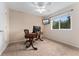Office space featuring a window with natural light, a ceiling fan and large desk at 1825 Cooper Ct, Castle Rock, CO 80109