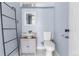 This bathroom features updated fixtures and a modern ladder for towel storage at 1740 S Ammons St # C, Lakewood, CO 80232