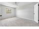 This airy bedroom boasts neutral colors, plush carpeting, and a ceiling fan at 1740 S Ammons St # C, Lakewood, CO 80232