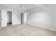 This airy bedroom boasts neutral colors, plush carpeting, and ample closet space at 1740 S Ammons St # C, Lakewood, CO 80232