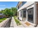 Charming condo with a secure front door, decorative bay window, and manicured front yard at 1740 S Ammons St # C, Lakewood, CO 80232