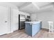 Modern kitchen with stainless steel appliances and island, offering a sleek and functional space at 1740 S Ammons St # C, Lakewood, CO 80232
