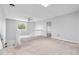 This bright loft features neutral decor, soft carpeting, and a ceiling fan at 1740 S Ammons St # C, Lakewood, CO 80232
