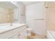 Bright bathroom features a vanity with ample storage space, neutral tiling and a shower over tub at 5711 W 92Nd Ave # 47, Westminster, CO 80031