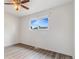 Clean bedroom featuring hard surface floors, a large window, and neutral walls at 5711 W 92Nd Ave # 47, Westminster, CO 80031