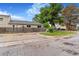 Townhouse exterior with parking, yard, and mature trees at 5711 W 92Nd Ave # 47, Westminster, CO 80031