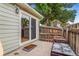 Enclosed patio with sliding glass door and wood fence at 5711 W 92Nd Ave # 47, Westminster, CO 80031