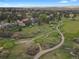 Wide aerial shot of a residential area adjacent to a beautiful golf course at 7605 E Windlawn Way, Parker, CO 80134