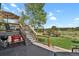 Backyard featuring stairs to yard, grill, and red Coca-Cola ice chest at 7605 E Windlawn Way, Parker, CO 80134