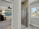Modern bathroom featuring tiled shower and window offering natural light and views, creating a spa-like atmosphere at 7605 E Windlawn Way, Parker, CO 80134