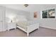 Bedroom with white furniture, overhead lighting, and bright window at 7605 E Windlawn Way, Parker, CO 80134
