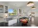 Updated kitchen featuring white cabinets, granite counters, stainless appliances, gas range, and hardwood floors at 7605 E Windlawn Way, Parker, CO 80134