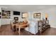 Inviting living room featuring a fireplace, hardwood floors, and comfortable seating, creating a warm atmosphere at 7605 E Windlawn Way, Parker, CO 80134