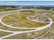 Aerial view of a large park with walking paths, playground, and open green spaces at 10088 E 62Nd Ave, Denver, CO 80238