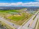 Aerial view of the community showcasing sports fields, open spaces, and well-planned infrastructure at 10088 E 62Nd Ave, Denver, CO 80238