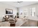 Bright living room with a cozy brown couch, stylish decor, and natural light, perfect for relaxation at 10088 E 62Nd Ave, Denver, CO 80238