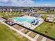 Community pool area with waterslide, cabana, and splash pad surrounded by neighborhood homes at 10088 E 62Nd Ave, Denver, CO 80238