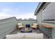 Relaxing rooftop deck with a modern fire pit, seating, and great overhead neighborhood views at 10088 E 62Nd Ave, Denver, CO 80238