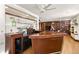 Basement bar with a boat-shaped counter and shelving at 595 S Race St, Denver, CO 80209