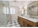 Elegant bathroom with double vanity, marble countertops, and a glass shower at 595 S Race St, Denver, CO 80209