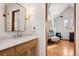 Bright bathroom with a single vanity, marble countertop, and sitting area at 595 S Race St, Denver, CO 80209