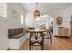 Bright dining area with built-in bench seating and a charming wooden table at 595 S Race St, Denver, CO 80209