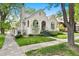 Beautiful stucco home with arched entryway and well-maintained landscaping at 595 S Race St, Denver, CO 80209