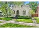 Charming stucco home with a welcoming front porch and manicured lawn at 595 S Race St, Denver, CO 80209