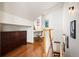 Upstairs hallway with built-in workspace and hardwood floors at 595 S Race St, Denver, CO 80209