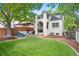 Backyard view of charming house with stucco exterior at 595 S Race St, Denver, CO 80209