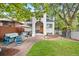 Backyard view of charming house with stucco exterior at 595 S Race St, Denver, CO 80209