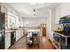 Renovated kitchen boasting white cabinets, modern appliances, and hardwood floors at 595 S Race St, Denver, CO 80209