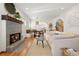 Inviting living room featuring a fireplace, built-in bench, and hardwood floors at 595 S Race St, Denver, CO 80209