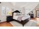 Spacious main bedroom with dark wood furniture and plenty of natural light at 595 S Race St, Denver, CO 80209