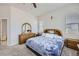 Main bedroom with a large bed and plenty of natural light at 16122 Emporia Way, Brighton, CO 80602