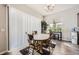 Bright dining area with hardwood floors and a table for four at 16122 Emporia Way, Brighton, CO 80602