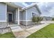 Front entrance with stone accents and a walkway leading to the home at 16122 Emporia Way, Brighton, CO 80602