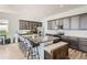 Modern kitchen with granite island, stainless steel appliances, and dark cabinetry at 16122 Emporia Way, Brighton, CO 80602